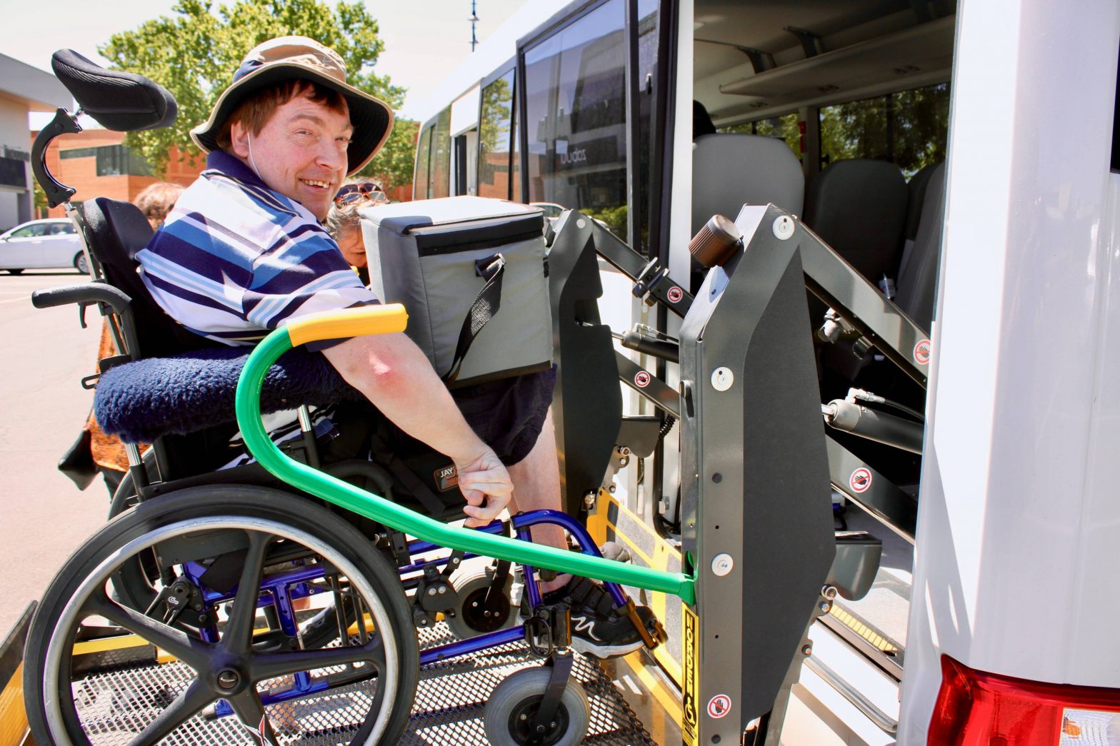 Man in wheelchair accessing bus